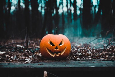 Jack-o-lantern in foggy forest