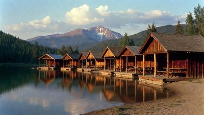 Wooden Cabins on Lake with Mountains
