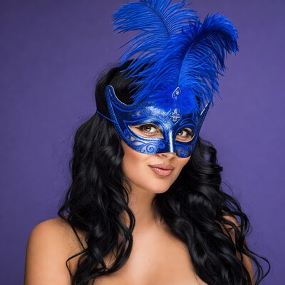 Woman in blue feather masquerade mask
