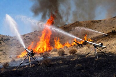 Water Cannons Extinguishing Hillside Wildfire