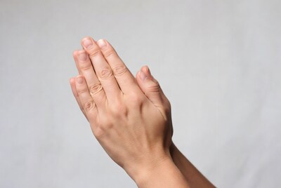 Praying hands together