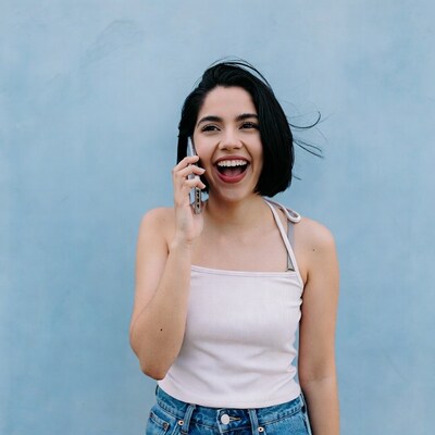 Latina woman laughing on phone