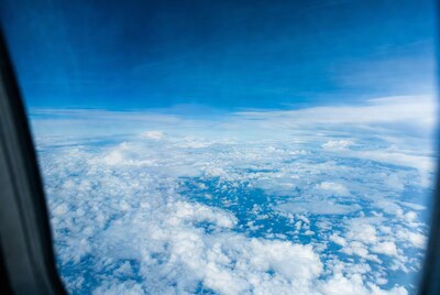 Airplane window clouds view