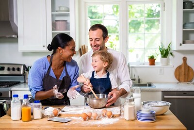 Family baking together in kitchen