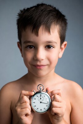 Boy holding stopwatch