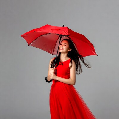 Asian woman holding red umbrella