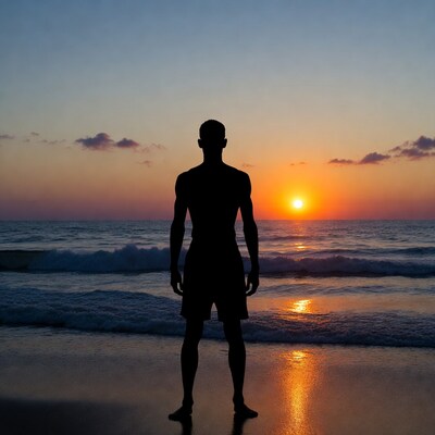 Silhouette of man at sunset beach