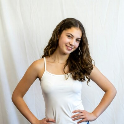 Smiling girl in white tank top
