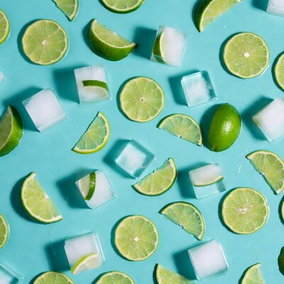Lime Slices and Ice Cubes on Blue