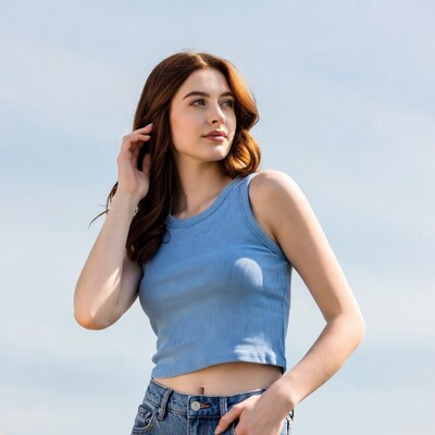 Redhead woman in blue tank top outdoors