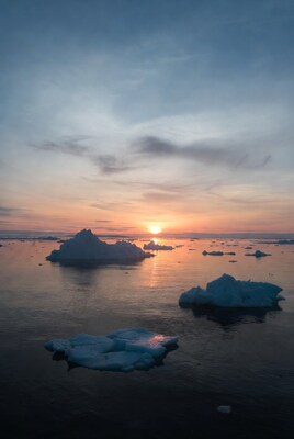 Icebergs at sunset over Arctic sea