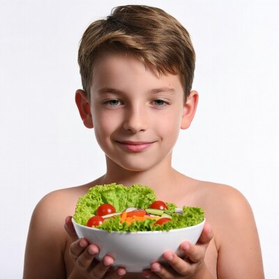 Boy holding salad bowl