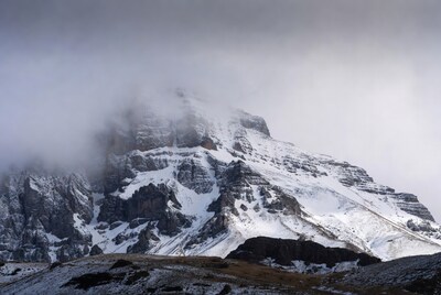 Snowy Mountain Peaks in Fog