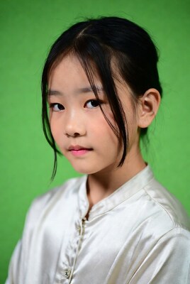 Asian girl in white shirt green background