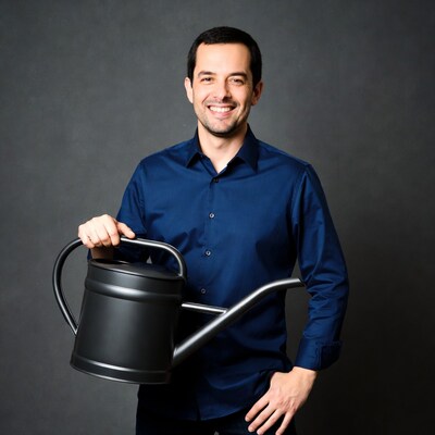 Man holding black watering can