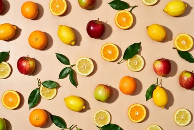 Oranges Lemons Apples on Beige Background