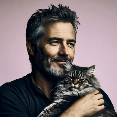Man holding gray tabby cat
