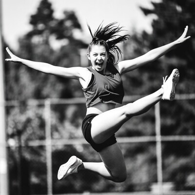 Woman jumping in athletic pose