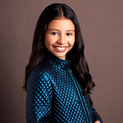 Smiling Latina girl in shiny blue jacket