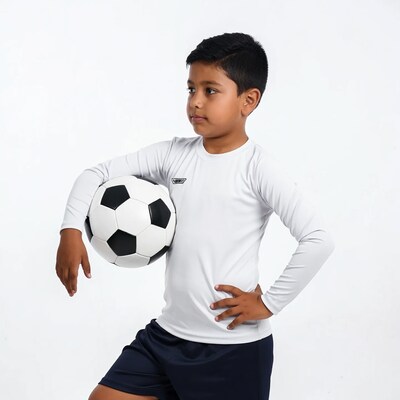 Young boy holding soccer ball