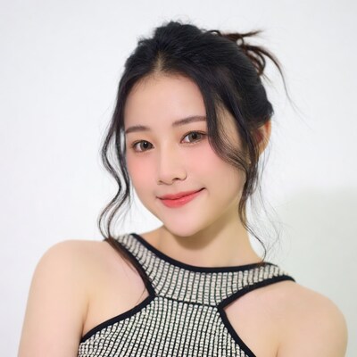 Asian woman smiling in black top