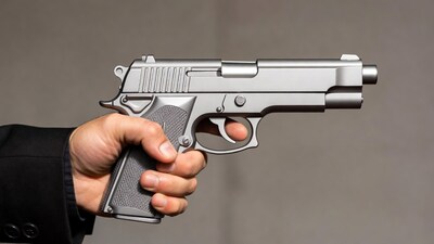 Man holding silver pistol