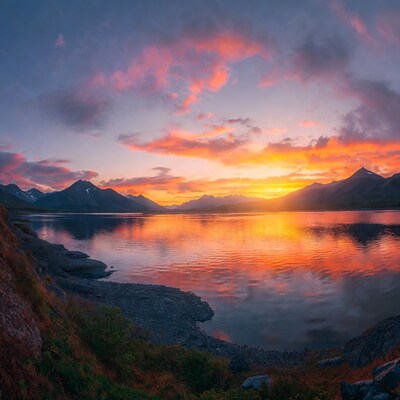 Sunset over mountains and lake