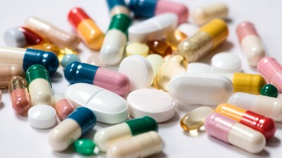 Colorful pills and capsules scattered