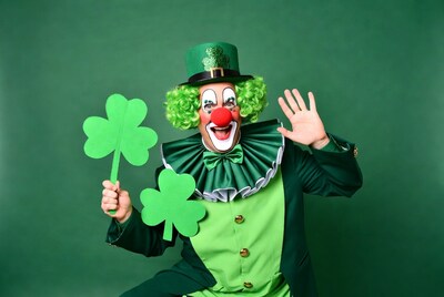 Clown holding shamrocks waving hand