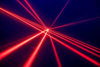 Red laser beams on dark blue background