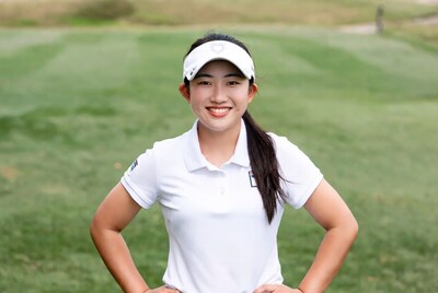 Asian woman golfer on green