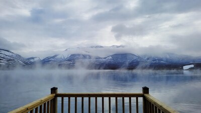 Snowy Mountains Over Foggy Lake