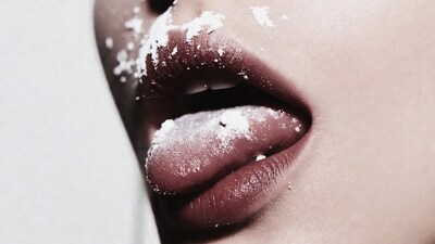 Woman's lips and tongue with powder