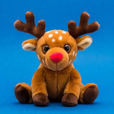 Rudolph plush toy on blue background