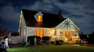 Halloween-decorated house at night
