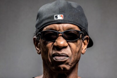 Elderly African-American man in baseball cap