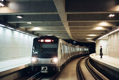 Man in suit waiting for subway train