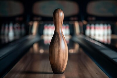 Wooden bowling pin on lane