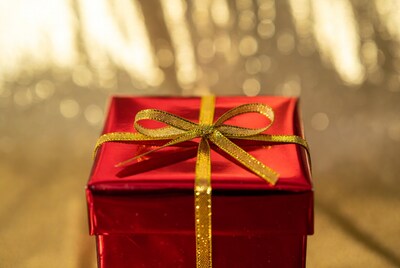 Red gift box with gold ribbon