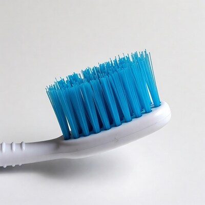 Blue bristle toothbrush on white background