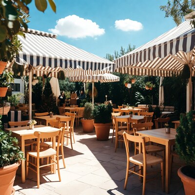 Outdoor cafe with striped awnings and wooden tables