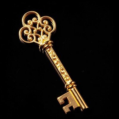 Ornate Golden Key on Black Background
