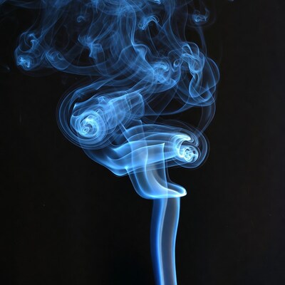 Blue Swirling Smoke on Black Background
