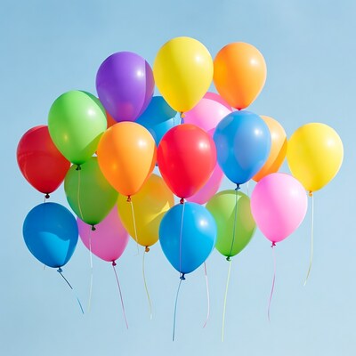 Colorful Balloons Floating Against Blue Sky