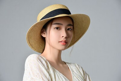 Asian woman wearing straw hat
