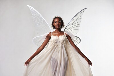 African-American woman with white fairy wings