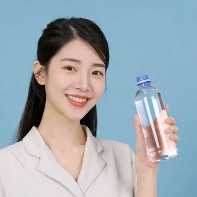 Asian woman holding water bottle