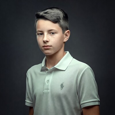 Boy with freckles in polo shirt