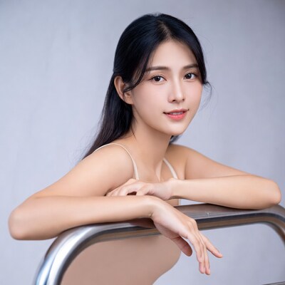 Asian woman leaning on railing