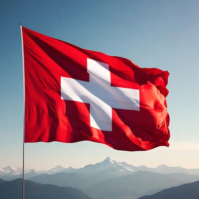 Swiss flag waving over mountains
